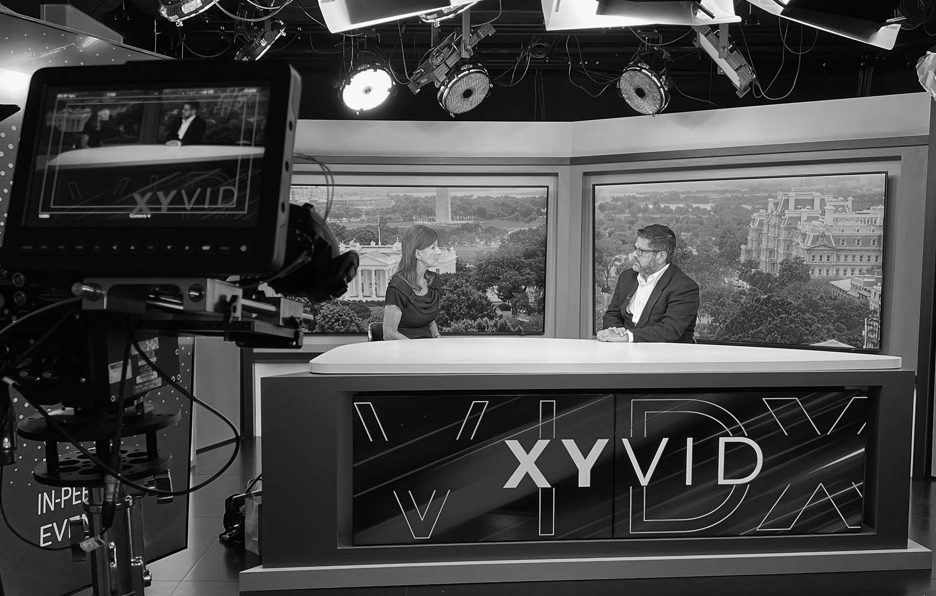Two presenters on a multicamera broadcast studio set from the recovered portfolio